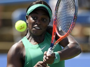 Sloane Stephens returns the ball against Andrea Petkovic, of Germany, during the Citi Open tennis tournament, Wednesday, Aug. 1, 2018, in Washington.