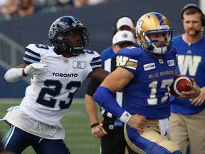 Blue Bombers QB Chris Streveler is chased out of bounds by Argonauts' DB T.J. Heath last week. The Alouettes traded for Heath and he will start for Montreal Friday vs. the Tiger-Cats.