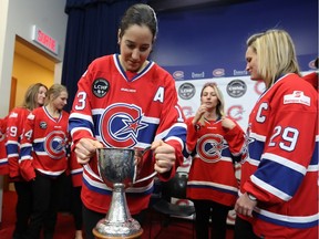 Members of Les Canadiennes, including Caroline Ouellette holding the Clarkson Cup, at the Bell Sports Complex in Brossard on March 8, 2017 during news conference following their Clarkson Cup win.