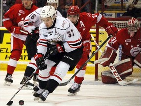 Owen Sound Attack centre Nick Suzuki controls the puck during first-period OHL playoff action against the Sault Ste. Marie Greyhounds on April 5, 2018, in Sault Ste. Marie, Ont.