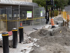 An entrance to the Édouard-Montpetit métro station is blocked during work related to the REM. Work at the McGill station is underway.