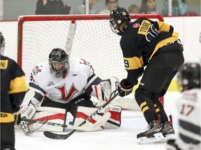 Lac St-Louis Lions midget AAA Kerfalla Toure slips the puck between St-Eustache Vikings goalie Nikolas Hurtibise for a goal during the Aug. 31 season opener in Dollard-des-Ormeaux. The Lions won 5-2. The Lions play back-to-back games this Friday and Saturday at the Dollard Civic Centre.