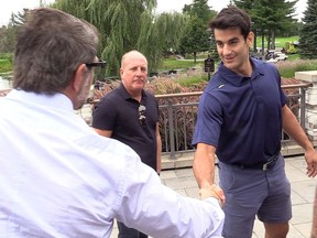 Canadiens general manager Marc Bergevin, left, shakes hands with team captain Max Pacioretty at Jonathan Drouin Golf Tournament on Sept. 6, 2018 in Terrebonne while Pacioretty’s agent, Allan Walsh, looks on.