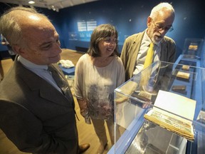 Portability was paramount for the volumes on display in Resplendent Illuminations, hence their modest scale. “To die without (recent) confession and communion was the worst possible thing” in the time of the Black Plague, says Brenda Dunn-Lardeau, with co-curators Hilliard T. Goldfarb, left, and Richard Virr, “so indeed you would consult your book of hours on an hourly basis.”