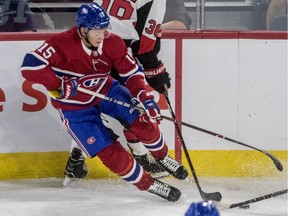 Canadiens' Jesperi Kotkaniemi fights for the puck during Rookie Showdown hockey against the Senators in Laval on Friday. Kotkaniemi struggled mightily in his first action for the Habs.