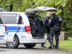 Police officers outside Beaconsfield High School, west of Montreal Tuesday September 11, 2018.