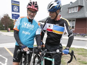 François Durocher, left, and Robert Masella, of Club vélo Dorval, on the bike path on Elm Ave. near the Beaconsfield train station. They are part of a coalition lobbying to raise awareness among municipal and provincial authorities for the establishment of safe trails, corridors and intersections for cycling in their respective areas.