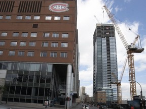 The Tour des Canadiens 2, right, sits across St-Antoine St. next to the Bell Centre. All of the condo units in the unfinished project have been sold.