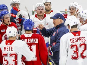 Canadiens coach Claude Julien addresses his team during training camp practice at the Bell Sports Complex in Brossard on Friday.