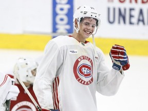 Golden smile: Montreal Canadiens 2018 first round draft choice Jesperi Kotkaniemi laughs while talking with goalie Michael McNiven during training camp practice at the Bell Sports Complex in Brossard on Sept. 14, 2018.