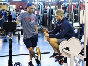 Former first-round NHL Draft picks Max Domi, left, and Joel Armia talk while waiting their turns during fitness testing on the first day of Canadiens' training camp at the Bell Sports Complex in Brossard on Sept. 13, 2018.