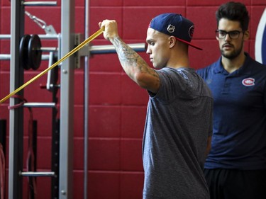 Newly-acquired Montreal Canadien Max Domi does exercises with an elastic band during fitness testing on the first day of training camp at the Bell Sports Complex in Brossard on Thursday,  Sept. 13, 2018.