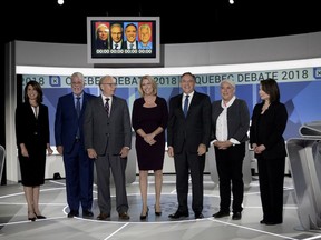 Co-host Debra Arbec, left to right, Quebec Liberal Party Leader Philippe Couillard, Parti Québécois Leader Jean-François Lisée, Jamie Orchard, Coalition Avenir Québec Leader François Legault, Québec solidaire co-spokesperson Manon Massé and Mutsumi Takahashi before the start of the English-language leaders' debate in Montreal on Monday September 17, 2018.