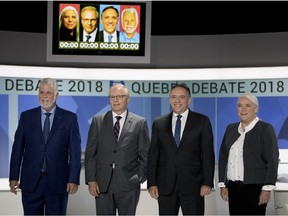 Liberal Party of Quebec leader Philippe Couillard, left to right, Parti Québécois (PQ) leader Jean-François Lisée, Coalition Avenir Quebec leader Francois Legault and Quebec solidaire co-spokesperson Manon Masse pose for a picture before the start of the English language leader's debate in Montreal on Monday September 17, 2018.
