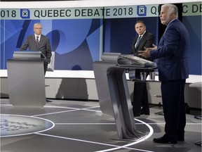 Parti Québécois (PQ) leader Jean-François Lisée, Coalition Avenir Québec leader François Legault listen as Liberal Party of Quebec leader Philippe Couillard speaks during English language leaders' debate in Montreal on Monday September 17, 2018. (Allen McInnis / MONTREAL GAZETTE/POOL) ORG XMIT: 61373