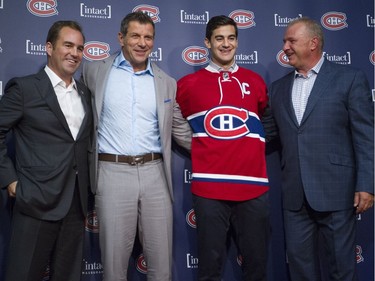 Smiles all around on Sept. 18, 2015 after team owner Geoff Molson (left) named Pacioretty captain, here posing with GM Marc Bergevin (second left) and head coach Michel Therrien.
