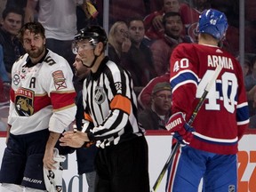 Florida Panthers defenceman Aaron Ekblad leaves the rink with a broken nose after fighting with Montreal Canadiens' Max Domi during NHL pre-season action in Montreal on Sept. 19, 2018.