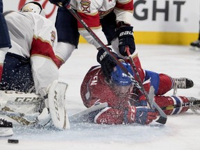 Canadiens' Will Bitten is pushed to the ice by Panthers defenceman Keith Yandle during pre-season action at the Bell Centre Wednesday night.