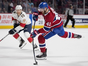 Left wing Paul Byron takes a slap shot on Florida Panthers goaltender Roberto Luongo as Florida Panthers defenseman Mike Matheson looks on during NHL pre-season action in Montreal on Wednesday, Sept. 19, 2018.