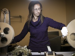 Marie-France Rousseau works in the NFB dry lab on Côte-de-Liesse.