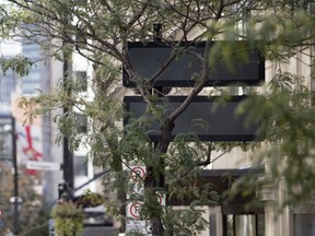 New electronic message boards installed on Sherbrooke St. near Crescent St. downtown aren't very easy to see at the moment.