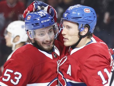 Brendan Gallagher, right, celebrates his goal against the Toronto Maple Leafs with Victor Mete during second period in Montreal Wednesday, Sept. 26, 2018.