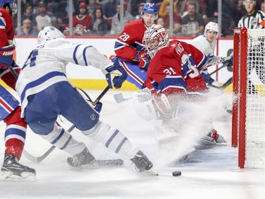 Carey Price slides across the crease as Toronto Maple Leafs' Auston Matthews can't get a stick on the pass during first period in Montreal Wednesday, Sept. 26, 2018.