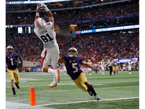 Darius Slayton (81) of the Auburn Tigers fails to pull in this touchdown reception against Myles Bryant (5) of the Washington Huskies at Mercedes-Benz Stadium on Saturday, Sept. 1, 2018, in Atlanta, Ga.