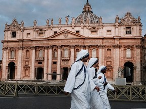 A group of nuns walk through St. Peter's Square at dawn on September 03, 2018 in Vatican City, Vatican.