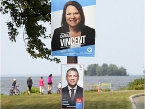 Election posters for Parti Quebecois candidate Carole Vincent and Liberal Enrico Ciccone in the Marquette riding, which covers Dorval and Lachine.