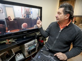 Francisco Moreno, at his home in LaSalle April 17, 2018, cues up video of a Chambly city council meeting that he had shot with his cell phone.