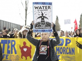 (FILES) In this file photo taken on March 10, 2018, Harriet Prince, 76, of the Anishinaabe tribe marches with Coast Salish Water Protectors and others against the expansion of Texas-based Kinder Morgan's Trans Mountain pipeline project, in Burnaby, British Columbia, Canada. - The Canadian Federal Court of Appeal on August 30, 2018, quashed the government's approval of the Trans Mountain pipeline to the Pacific, siding with indigenous people worried about increased tanker traffic harming whales along the coast.