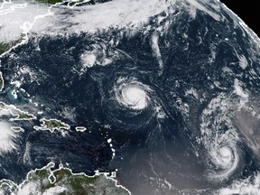 This NOAA/RAMMB satellite image shows (L-R) Tropical Storm Florence, Tropical Storm Isaac and Tropical Storm Helene in the Atlantic Ocean.