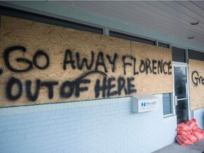 A sign is seen on a boarded up vacation rentals office near Wrightsville beach, North Carolina Sept. 12, 2018.