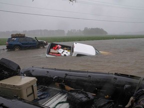 TOPSHOT - A pickup truck is seen submerged in floodwater in Lumberton, North Carolina, on September 15, 2018 in the wake of Hurricane Florence. - Besides federal and state emergency crews, rescuers were being helped by volunteers from the "Cajun Navy" -- civilians equipped with light boats, canoes and air mattresses -- who also turned up in Houston during Hurricane Harvey to carry out water rescues.