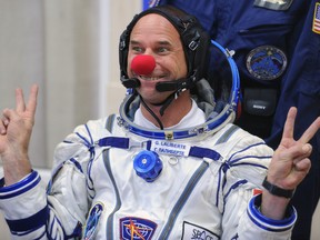 Guy Laliberté jokes during space suit testing prior to his blastoff for the ISS in a Russian Soyuz TMA-16 rocket in 2009.