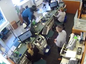 Alain Ste-Marie (in blue) at a bank robbery in Mile End on Sept. 2, 2016.