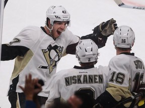 Pittsburgh Penguins defenceman Simon Després, left, celebrates scoring the winning goal against Canadiens goalie Carey Price at the Bell Centre on March 2, 2013.  The 6-foot-4, 233-pound Després isn't exactly old, but the 27-year-old Laval native is battling to reclaim a career that was interrupted by concussions. He is in the Canadiens' camp on a professional tryout.