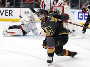 Vegas Golden Knights' Tomas Tatar celebrates a goal by left wing David Perron as Washington Capitals goaltender Braden Holtby, left, lies on the ice during the second period in Game 5 of the NHL Stanley Cup finals on June 7, 2018, in Las Vegas.