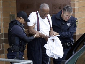 Bill Cosby is escorted out of the Montgomery County Correctional Facility Tuesday Sept. 25, 2018 in Eagleville, Pa., following his sentencing to three-to-10-year prison sentence for sexual assault.