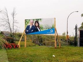 Liberal and Parti Québécois election signs have been placed near the Black Rock, a monument to the 6,000 poor Irish immigrants who escaped the Great Famine only to die of typhus in Montreal in 1847 near the Victoria Bridge. Photo courtesy of Victor Boyle