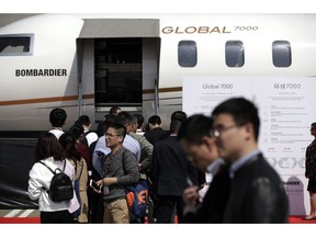 Bombardier Inc. says the Global 7500 -- originally dubbed the Global 7000 -- will receive certification from Canada's transport regulator Friday afternoon, paving the way for the plane-and-train maker to start delivering its largest business jet to clients. Visitors line-up to go inside a Bombardier Global 7000 business jet cabin on display at Hongqiao International Airport during the Asian Business Aviation Conference and Exhibition (ABACE) in Shanghai, Tuesday, April 17, 2018.