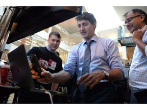 A new report says artificial intelligence deployment has not yet been a "real success" for Canadian companies, in spite of the country's reputation as an AI hotbed. Prime Minister Justin Trudeau speaks employees of artificial intelligence companies at the University of Toronto in Toronto on Thursday, Oct. 26, 2017.