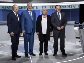 PQ Leader Jean-François Lisée, Liberal Leader Philippe Couillard, QS Leader Manon Massé and CAQ Leader François Legault, left to right, stand for a photo prior to the leaders' debate in Montreal on Thursday, Sept. 13, 2018.