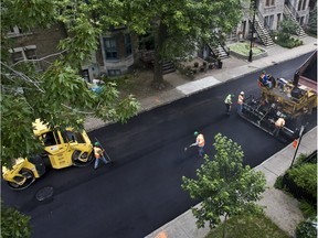 Montreal road crews pave a street in 2009.