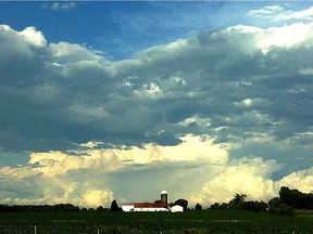 After a storm, clouds hang over a Quebec farm.