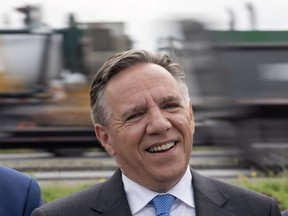 Coalition Avenir Quebec Leader Francois Legault responds to questions during a news conference next to a busy highway in St-Hubert, Que., Tuesday, Sept. 18, 2018.