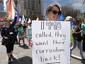 Ontario elementary teachers' supporters protest against to the sex-ed rollback at Queen's Park in Toronto Aug. 14, 2018.