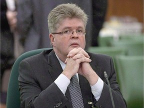 Public sector integrity commissioner Mario Dion is shown in Ottawa on December 13, 2011. Canada's ethics watchdog says he would like to have greater powers to impose penalties against cabinet ministers and public office holders who violate conflict rules, including the ability to levy fines of up to $10,000.