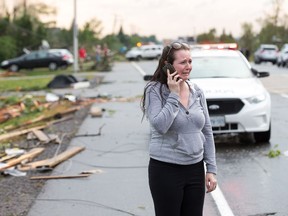 Christy Jarvis outside the home of her cousin before learning the people inside had been rescued and taken to hospital as a reported tornado touched down in Dunrobin in the far west end of Ottawa.